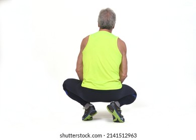 Back View Of A Senior Man With Sportswear Squatting On White Background