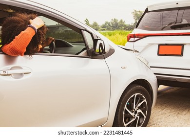 Back view shocked african american woman drove at high speed and failed to brake, colliding with the rear of the car and damaging the front reckless driving until accident
 : Car insurance concept.
 - Shutterstock ID 2231481445