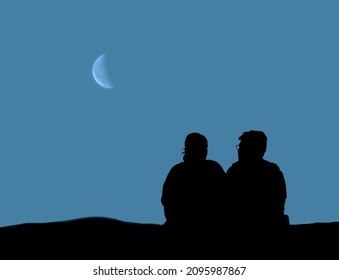 Back view of silhouette traveler couple sitting together and looking at beautiful sunrise or sunset on the top of mountain with clear sky in background. Man and woman watching on moon