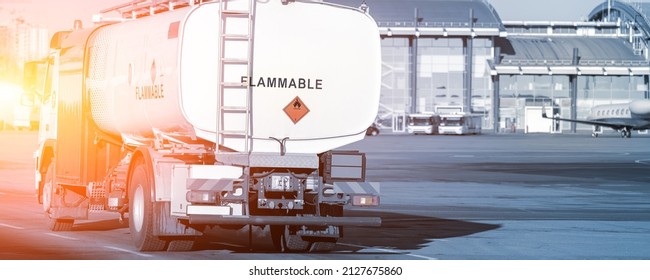 Back View Small Modern Fuel Tanker Truck Driving On Airfield Taxiway For Aircraft Refueling. Cistern Lorry Aviation Gasoline. Plane Gas Supply. Airport Maintenance Handling Service Vehicle Equipment