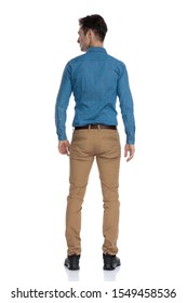 Back View Of Smart Casual Man In Blue Shirt Looking To Side And Standing Isolated On White Background, Full Body