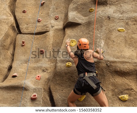 Similar – Image, Stock Photo Girl climbs climbing wall