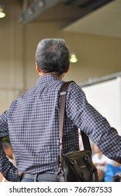 Back View Of Standing Asian Gen X Boss In Casual Costume