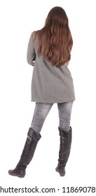 Back View Of Standing Young Beautiful  Woman.  Brunette Girl In Jeans And Coat Watching;. Rear View People Collection.  Backside View Of Person.  Isolated Over White Background.