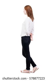 Back View Of Standing Young Beautiful  Blonde Woman In Jeans. Girl  Watching. Rear View People Collection.  Backside View Of Person.  Isolated Over White Background.