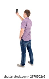 Back View Of Standing Young Men And Using A Mobile Phone. Rear View People Collection. Backside View Of Person. Isolated Over White Background