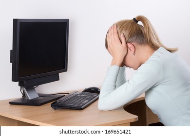 Back View Of Stressed Woman With Personal Computer At Work In Office