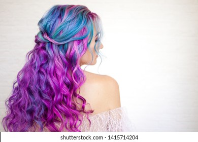 Back view stylish youth girl and bright hair coloring  Ombre and blue purple shades  Hair care and bright coloring