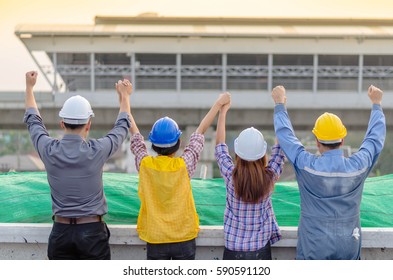 Back View Of  Success Engineer Team With Blur View Of Main Infastructure  At Construction Site.