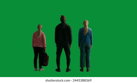 Back view of a team of three hikers looking out and admiring the view. A group of people in a studio on a green screen. Travel concept. - Powered by Shutterstock