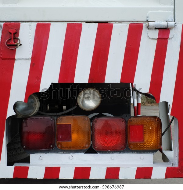 Back view\
of truck. Tail light of truck for\
traffic.