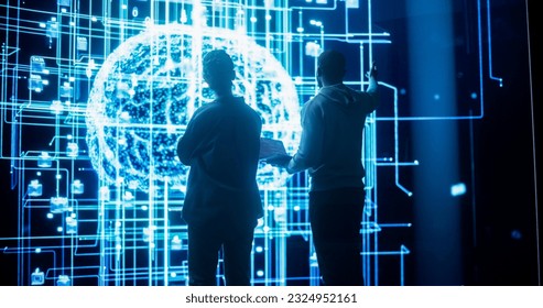 Back View of Two Diverse Colleagues Looking at a Big Screen with Neural Network 3D Visualisation. Professional Computer Data Scientists Discussing and Working on Monitoring Private Information