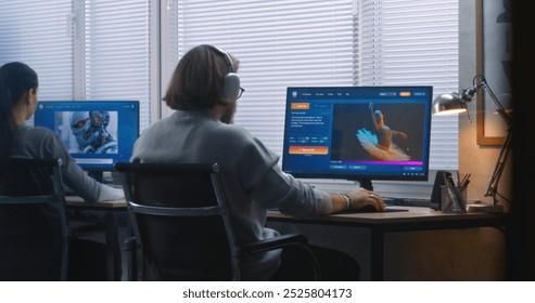 Back view: Two diverse workers using AI generator on computers in office. PC screens showing artificial intelligence chatbot generating text prompt to realistic photo or video content. Generative art.