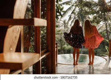 Back View Two Happy Girlriends In Summer Dresses Stand Near The Swiming Pool, Weekend With Friends