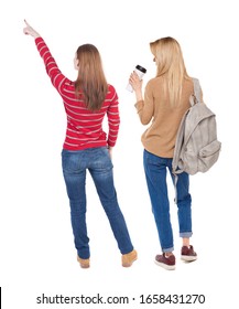 Back View Of Two Pointing Girl In Sweater. Rear View People Collection. Backside View Of Person. Beautiful Woman Showing Gesture. Rear View. Isolated Over White Background.