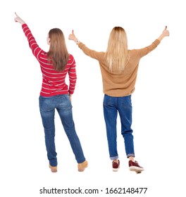 Back View Of Two Pointing Girl In Sweater. Rear View People Collection. Backside View Of Person. Beautiful Woman Showing Gesture. Rear View. Isolated Over White Background.