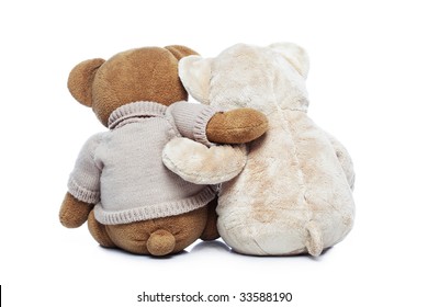 Back View Of Two Teddy Bears Hugging Each Other Over White