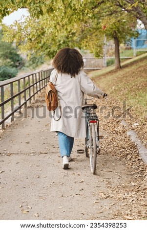 Similar – Image, Stock Photo Anonymous woman with backpack in boarding bridge