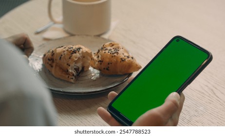 Back view unrecognizable guy man male client visitor cafe restaurant eat lunch coffee on table hold cellphone pay bill online food delivery buy shopping mobile phone green screen chroma key copy space - Powered by Shutterstock