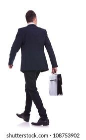 Back View Of A Walking Business Man Holding A Briefcase And Looking To His Side On White Background