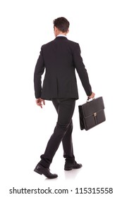 Back View Of A Walking Business Man Holding A Briefcase And Looking To His Side On White Background