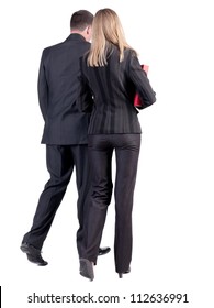 Back View Of Walking Business Team. Going Young Couple With Books. Girl And Guy In Suit Go Get An Education. Rear View People Collection. Backside View Of Person. Isolated Over White Background