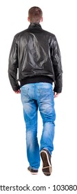 Back view of walking handsome man in jacket.   going young guy in jeans and  jacket. Rear view people collection.  backside view of person.  Isolated over white background.