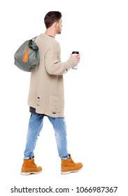 Back View Of Walking  Man  With Coffee Cup And Green Bag. Backside View Of Person.  Rear View People Collection. Isolated Over White Background. 