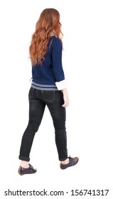 Back View Walking Woman. Beautiful Redhead Girl In Motion. Backside View Person.  Rear View People Collection. Isolated Over White Background. Girl In Blue Sweater And A White Shirt Is Moving Forward