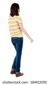 Back View Of Walking  Woman In Jeans . Beautiful Brunette Girl In Motion.  Backside View Of Person.  Rear View People Collection. Isolated Over White Background.