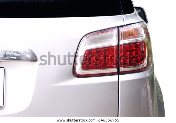 Back view of white car.\
White car and taillight. White car isolated. White car for\
transportation.