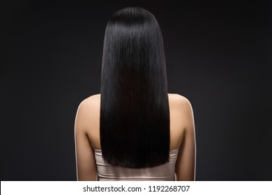 Back View Of Woman With Beautiful Shiny Hair Isolated On Black