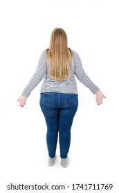 Back view of woman confusing. Young shocked woman with hands up. Full length of beautiful plus size young overweight woman wearing jeans and shirt. Isolated on white background 