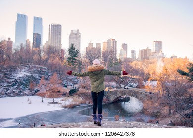 Back View Of Woman Enjoy The View Of Ice-rink In Central Park And Skyscrapers On Manhattan In New York City