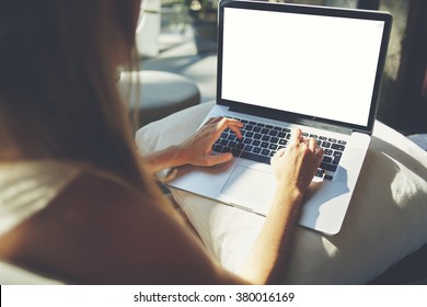 Back view of woman freelancer is working on a new project on laptop computer with blank copy space screen for your advertising text message, hipster girl keyboarding on net-book while relaxing at home - Shutterstock ID 380016169