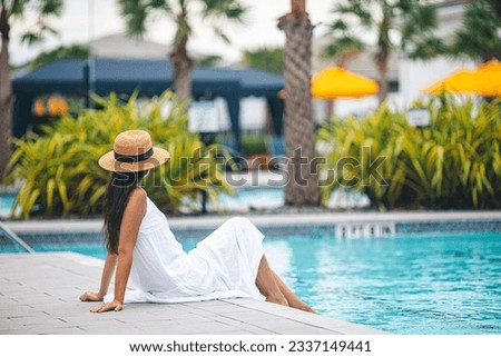 Similar – Image, Stock Photo A beautiful brunette girl is feeling just fine in this playground. Just a fine model test with a pretty woman in a black outfit. Looking straight into the camera and being all gorgeous.
