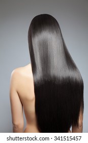 Back View Of A Woman With Long Straight Hair