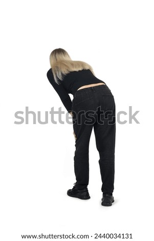 back view of a woman looking down on white background