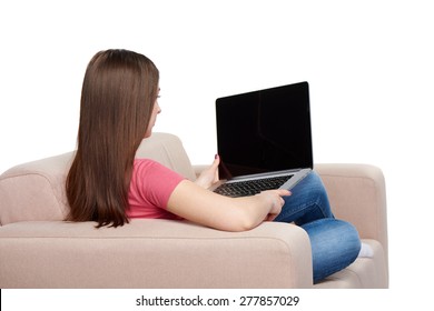 Back View Of Woman On Sofa Using Laptop, Black Screen For Your Text