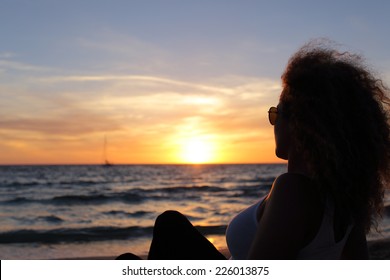 Back View Of A Woman Silhouette Watching A Sunset In Ibiza Beach