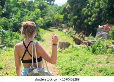 Back view of Woman Smoking Weed in Jamaica