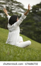 Back View Of Woman Stretching Her Arms Outdoor