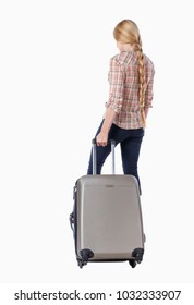Back view of woman with suitcase looking up. Standing young girl. Rear view people collection.  backside view of person.  Girl with very long hair pulling a suitcase on wheels.