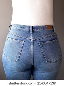 Back View Of A Woman Wearing High Waisted Blue Jeans. Denim Day Holiday Concept. Copy Space.