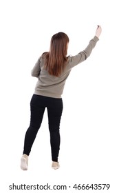 back view writing beautiful woman  Rear view people collection   backside view person  Isolated over white background  A young girl in gray sweater pulled up and felt  tip pen in hand 