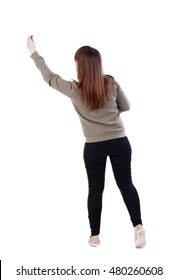 back view writing beautiful woman  Isolated over white background  A young girl in gray sweater pulled up and felt  tip pen in hand 
