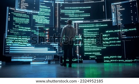 Back View of Young Black Man Walking and Looking at Big Digital Screens Glitching While Displaying Code Lines. Professional Hacker Breaking Through Cybersecurity Protection System, Changing Code