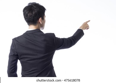 Back view of young businessman pointing something on white background - Shutterstock ID 475618078