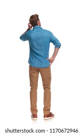 Back View Of A Young Casual Man Scratching His Head On White Background