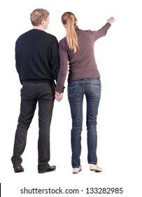 Back view of young couple (man and woman) hug and pointing. beautiful friendly girl and guy together. Rear view. Isolated over white background. wife says to her husband that the important
